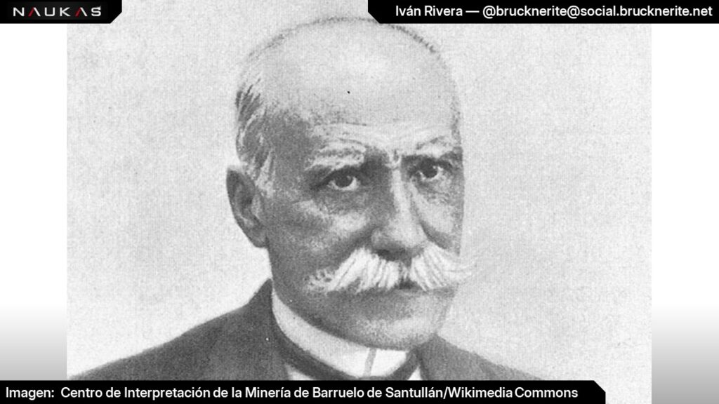 Charla "La maldición de la pata de mono", Naukas Guardo 2024, diapositiva 25. Fotografía en blanco y negro de primer plano de Mariano Zuaznávar. Un hombre calvo con gran bigote cano y vestido con traje formal típico de finales del siglo XIX.